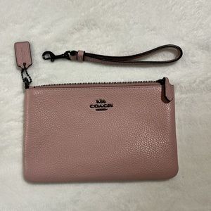 Like new Coach Large Pouch pebbled leather wristlet blush pink
